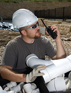 Construction Worker using Two-Way Radios